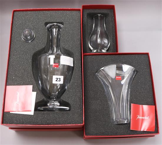 A Baccarat decanter and two vases, all cased decanter height 34.5cm